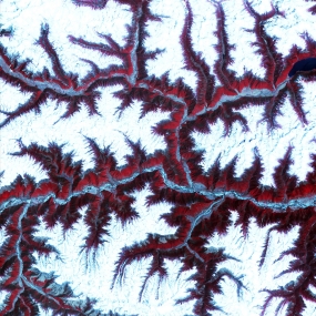 April 12th, 2001: Description: Soaring, snow-capped peaks and ridges of the eastern Himalaya Mountains create an irregular white-on-red patchwork between major rivers in southwestern China. The Himalayas are made up of three parallel mountain ranges that together extend more than 2,900 kilometers. Source: ASTER To learn more about the Landsat satellite go to: http://landsat.gsfc.nasa.gov/